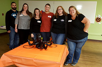 ShounBach volunteers set up for a Halloween party at NVFS' SERVE Family Shelter