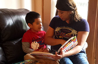 A family enrolled in NVFS Healthy Families, reading