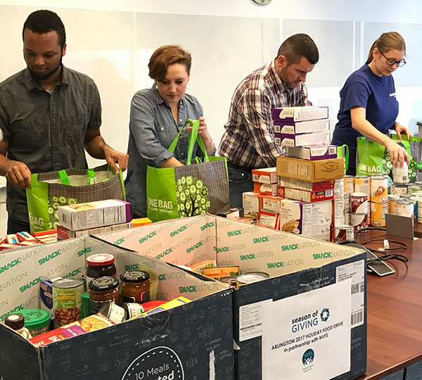 Evolent Health employees assembled holiday food bags in December 2017.