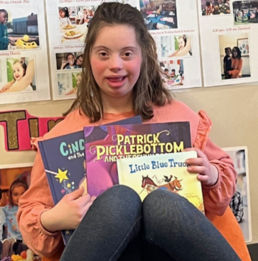 Emily reading to children in Early Start